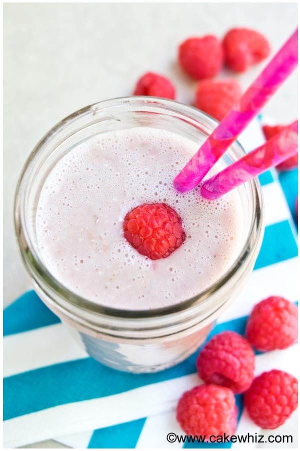 Homemade Smoothie in Glass Cup With Pink Straw- Overhead Shot
