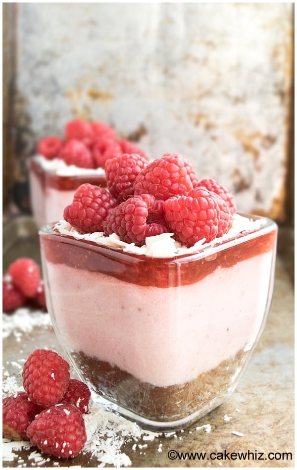 Easy Raspberry Mousse With Gelatin in Glass Cup With Brownie Bottom on Rustic Background