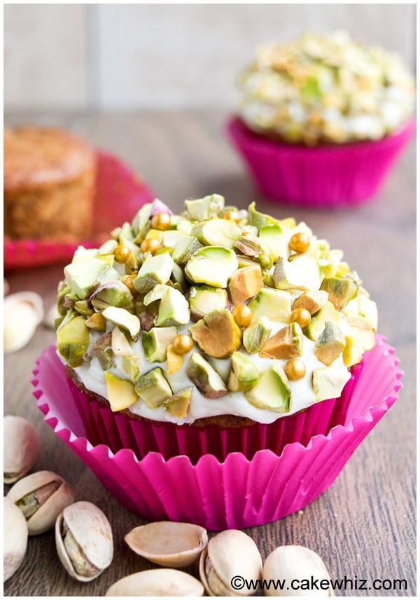 Easy Homemade Carrot Cupcakes With Cream Cheese Frosting and Pistachios in Pink Liners