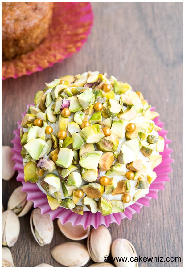 Overhead Shot of Pistachio And Gold Edible Pearl Decoration on Cupcake