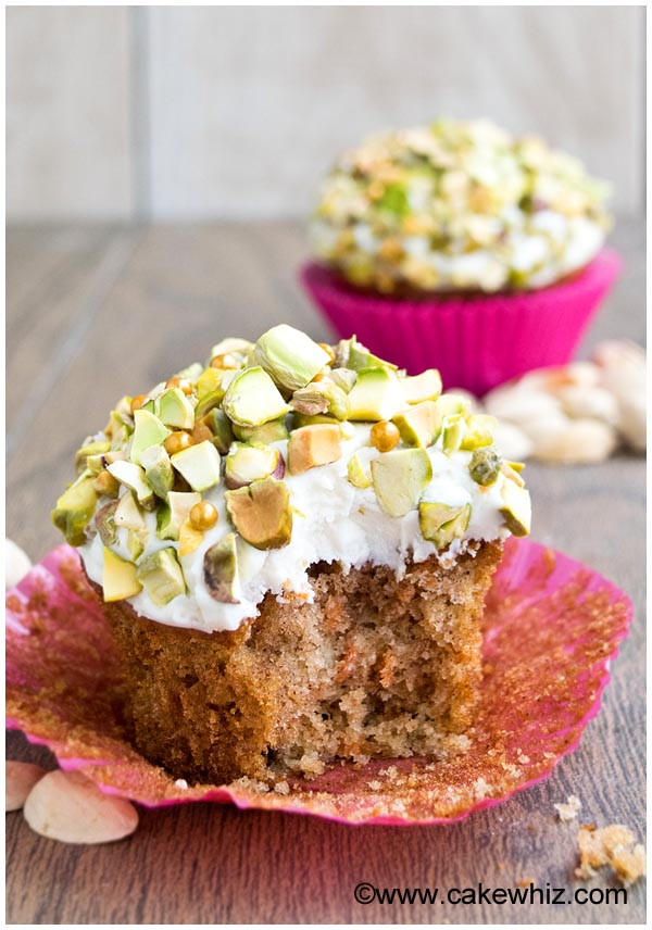 Partially Eaten Carrot Cake Cupcakes on Rustic Background