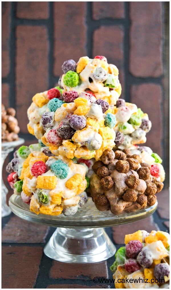 Stack of Rainbow Cereal Balls on Glass Cake Stand