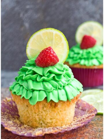 Easy Lemon Raspberry Cupcakes With Liner Removed on Rustic Background