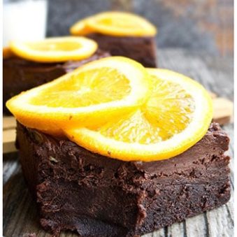 Partially Eaten Chocolate Orange Brownies on Gray Wood Background.