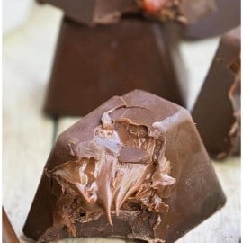 Easy Homemade Gourmet Chocolate (Fancy Chocolate) With Nutella Filling on Wood Background