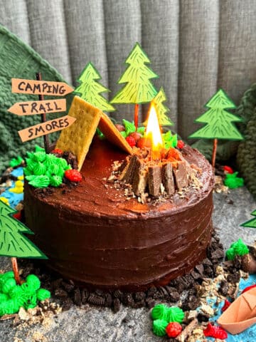 Easy Camping Cake With Real Fire on Rustic Gray Cake Board.