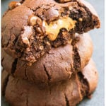 Stack of Three Triple Chocolate Cookies on Gray Background