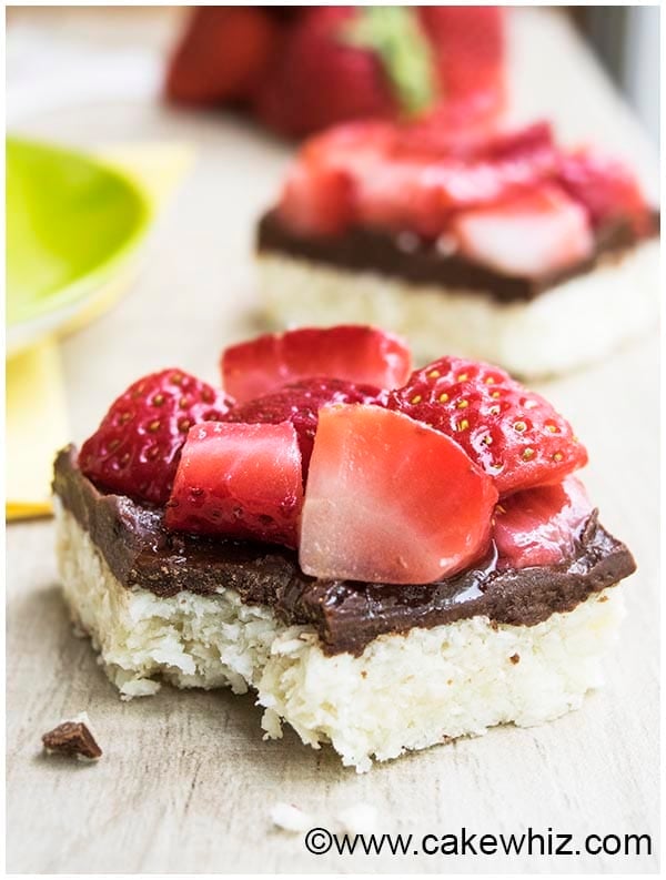 Partially Eaten Macaroon Bars With Chocolate and Strawberries