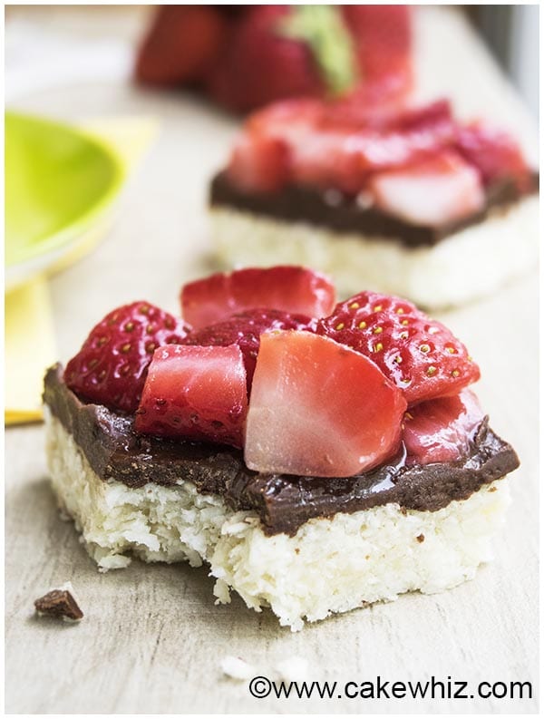 Partially Eaten Macaroon Bars With Chocolate and Strawberries