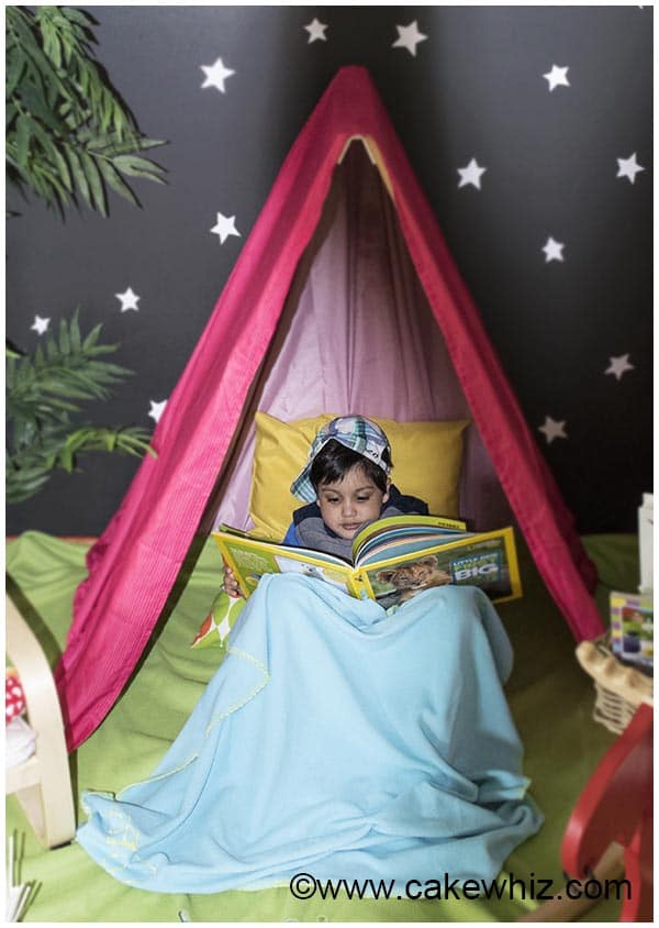 Kid Reading Books Inside DIY tent