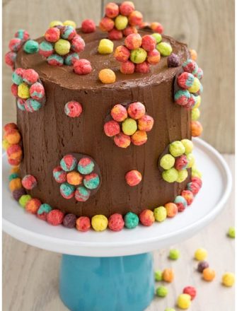 Easy Homemade Cereal Cake on White Cake Stand With Wood Background
