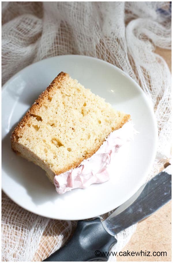 Slice of Pound Cake with Pink Frosting on White Plate