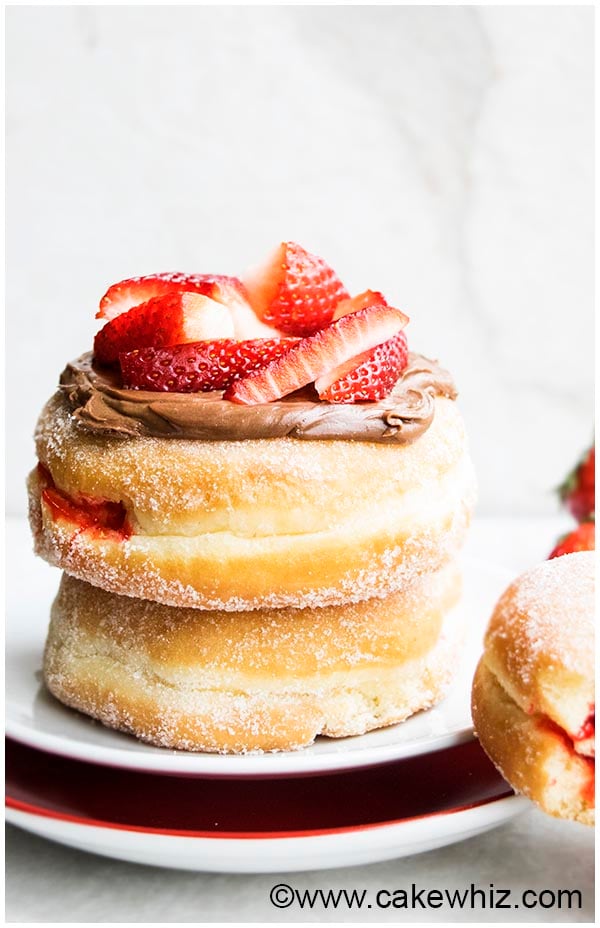 Jam Doughnuts With Chocolate Frosting and Strawberry Topping
