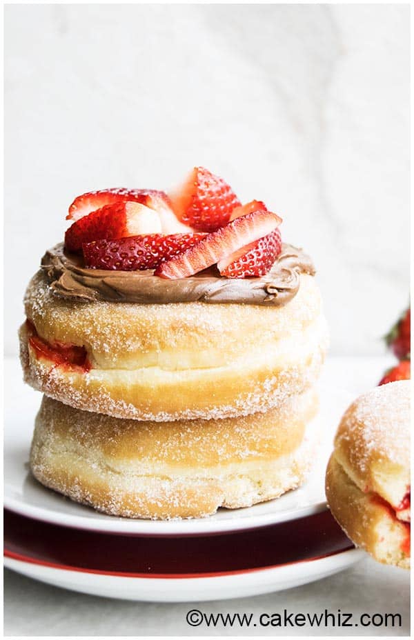 Jam Doughnuts With Chocolate Frosting and Strawberry Topping