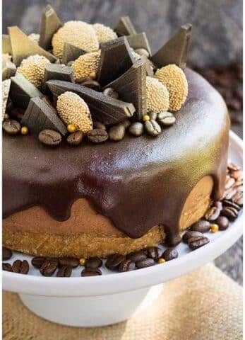 Easy No Bake Coffee Cheesecake With Ganache Topping and Chocolate Decorations.