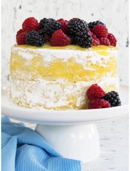 Moist Lemon Cake With Lemon Curd Filling on White Cake Stand