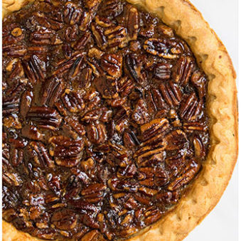 Classic Homemade Easy Pecan Pie on White Background- Overhead Shot