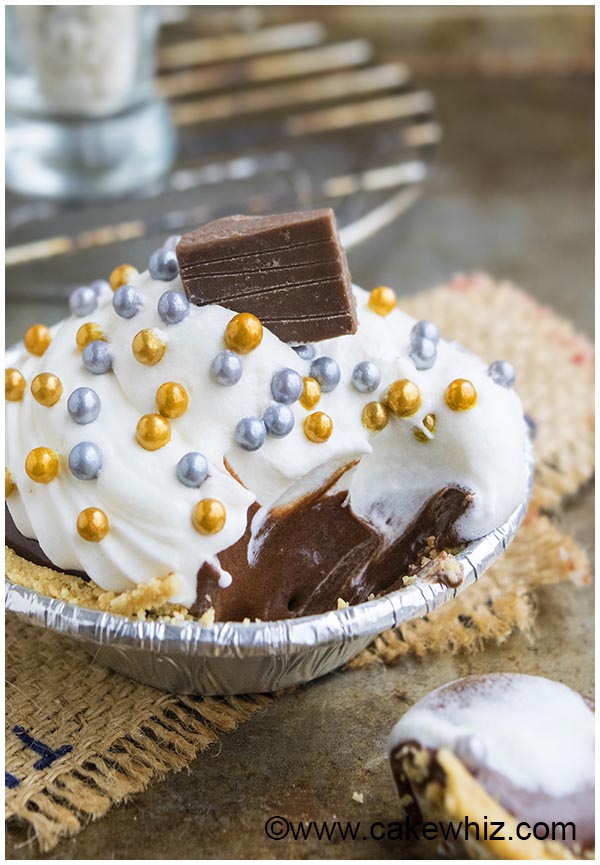 Partially Eaten Mini Chocolate Tartlet With Graham Cracker Crust on Rustic Background