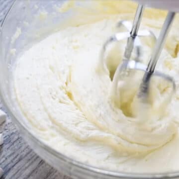Fluffy white icing in glass bowl. 