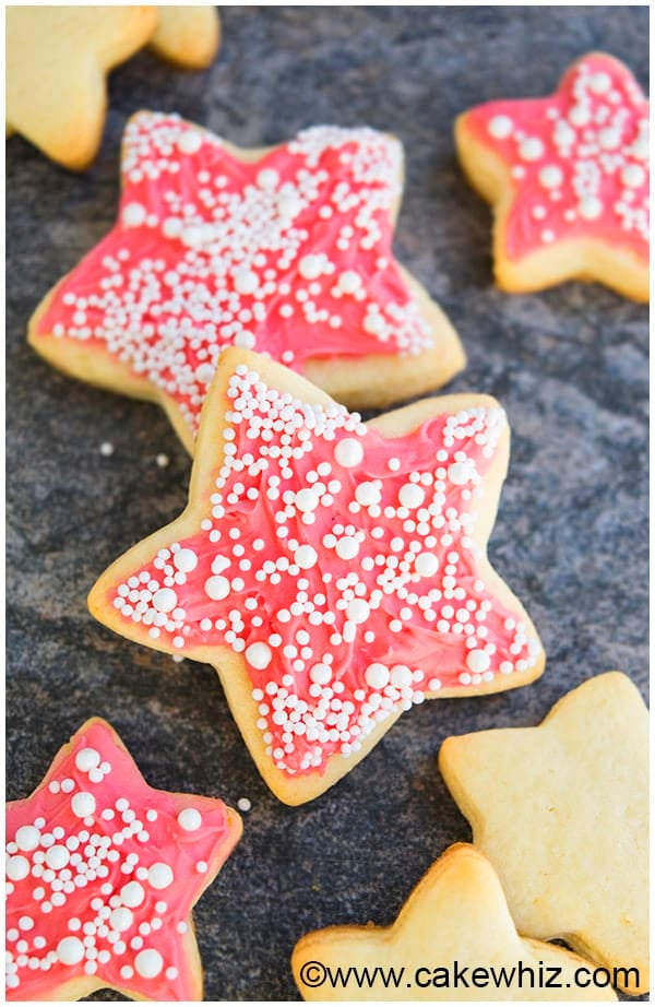 Champagne Cut Out Cookies With Pink Champagne Frosting on Gray Background