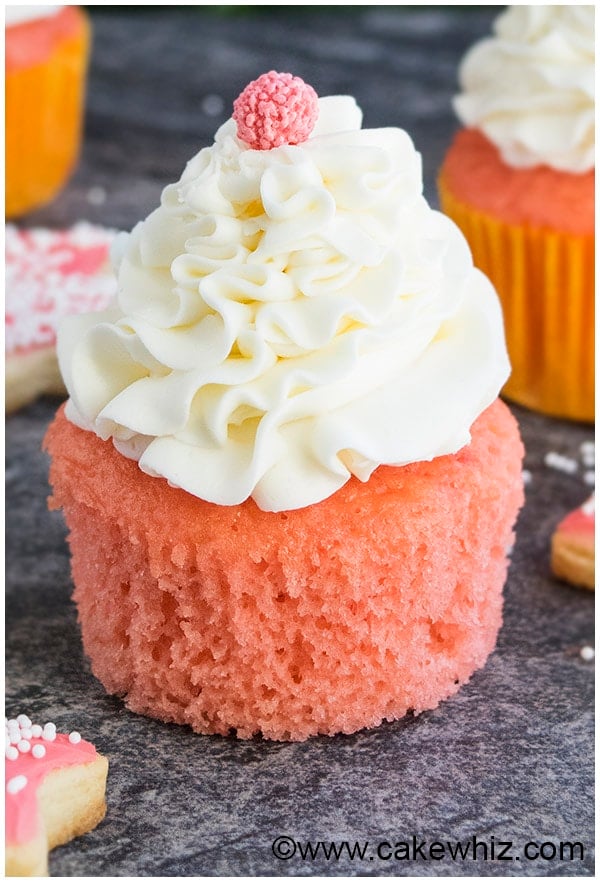 Pink Champagne Cupcakes With Champagne Buttercream Frosting on Rustic Gray Background