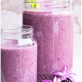 Easy Blackberry Smoothie in Glass Jars With Marble Background.