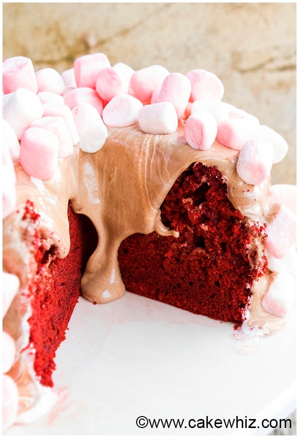 Partially Sliced Best Red Velvet Cake With Icing Dripping
