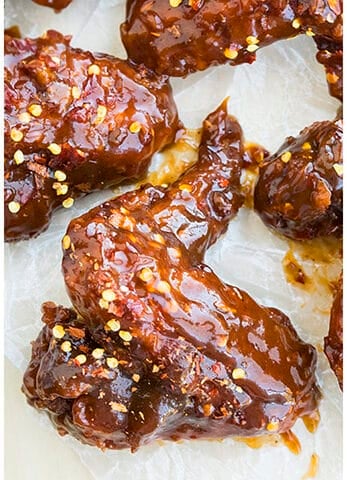 Easy Spicy Honey BBQ Wings on Sheet of Wax Paper.
