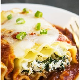 Easy Spinach Lasagna Rolls on White Dish.