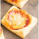 Easy Mini Puff Pastry Pizza Appetizer on Wood Background.