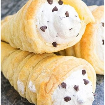 Stack of Best Easy Cream Horns With Puff Pastry on Rustic Gray Background.