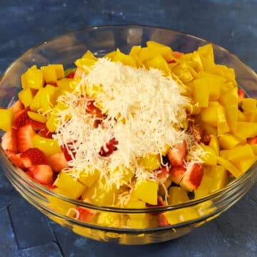 Shredded coconut added on top of fruits.