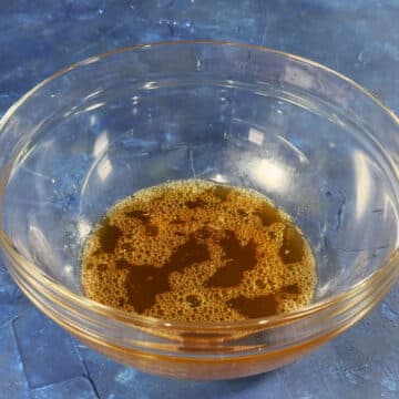Honey lime dressing in glass bowl.