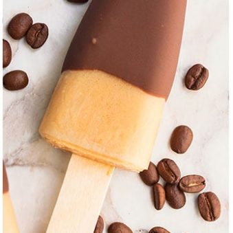 Easy Chocolate Covered Coffee Popsicles on Marble Background.