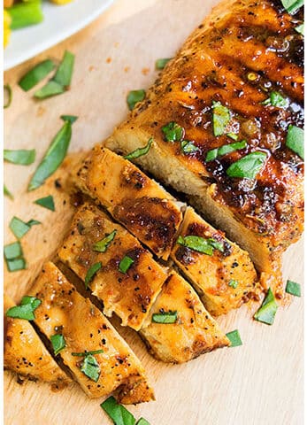 Easy Sliced Grilled Chicken Breast on Wood Board.