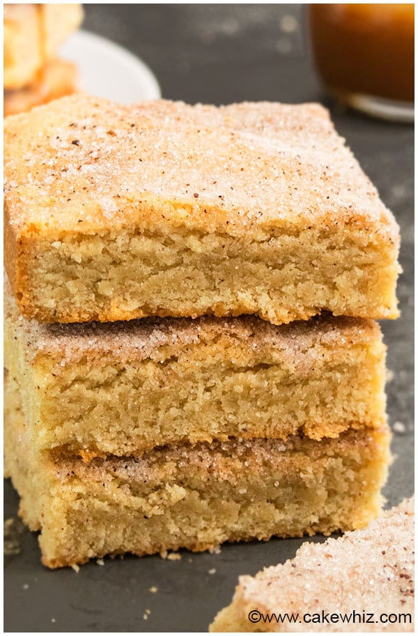 Easy Snickerdoodle Cookie Bars Stacked on a Rustic Gray Background