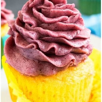 Best Easy Blackberry Buttercream Frosting Piped on Top of Yellow Cupcake.