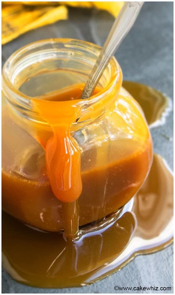 Easy Homemade Caramel Sauce in Glass Jar on Gray Background