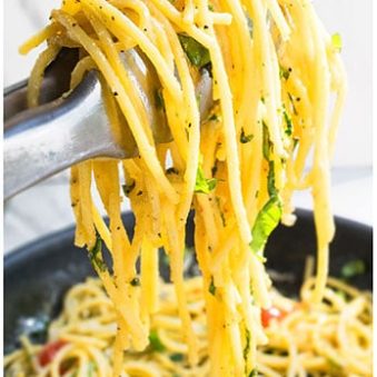 Tongs Full of Easy Tomato Basil Pasta.