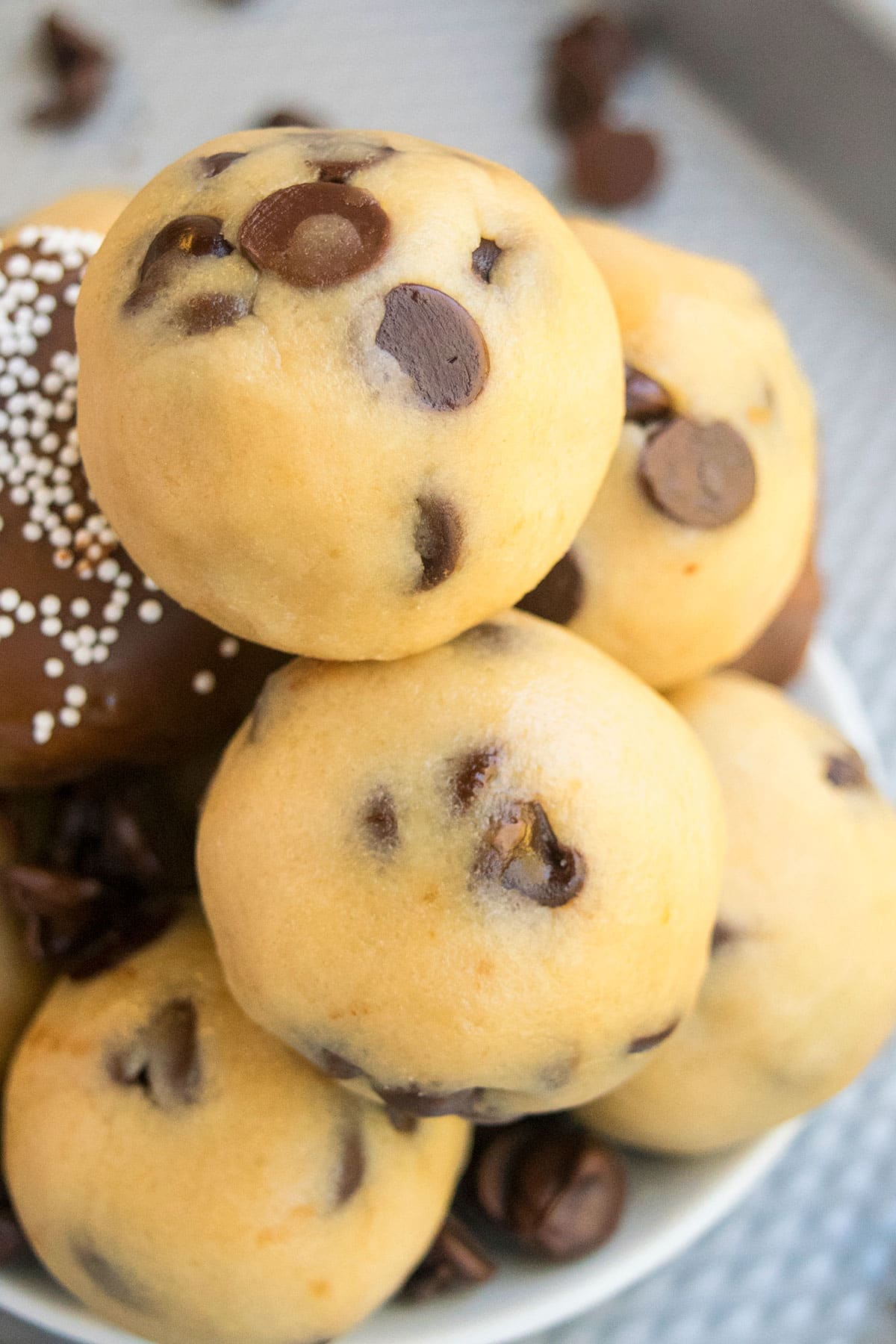 Edible and safe cookie dough balls on white dish.