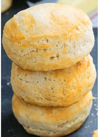 Stack of Best Easy Homemade Buttermilk Biscuits on Dark Gray Background.