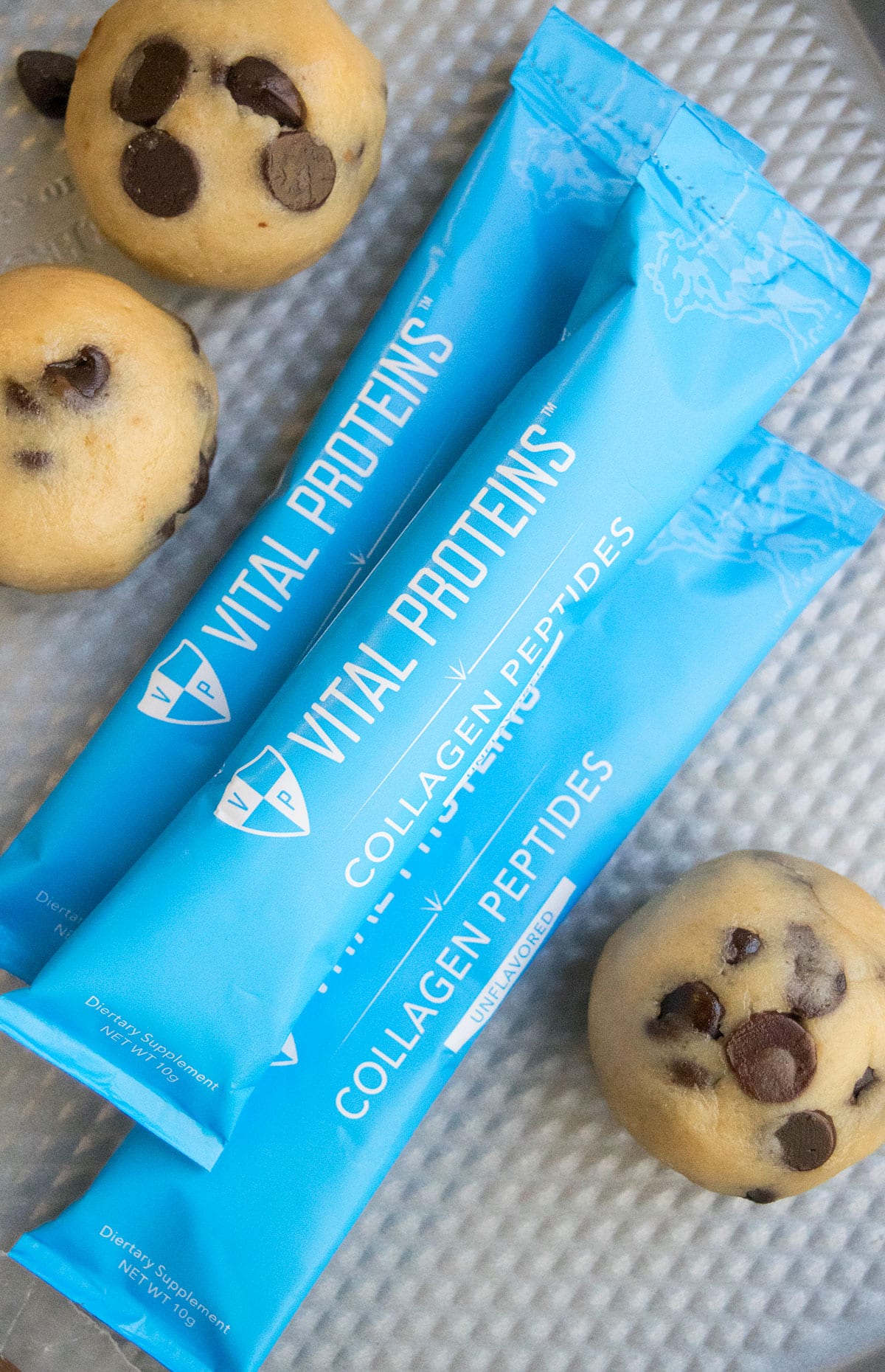 Vital proteins collagen peptide packets on baking tray.