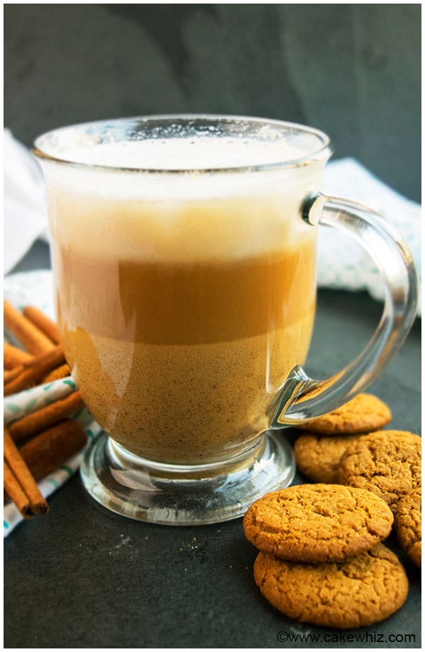 Easy Homemade Gingerbread Latte in Glass Mug on Black Stone Background. 