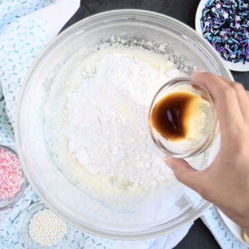 Powdered sugar, corn syrup and vanilla extract added to meringue mixture. 