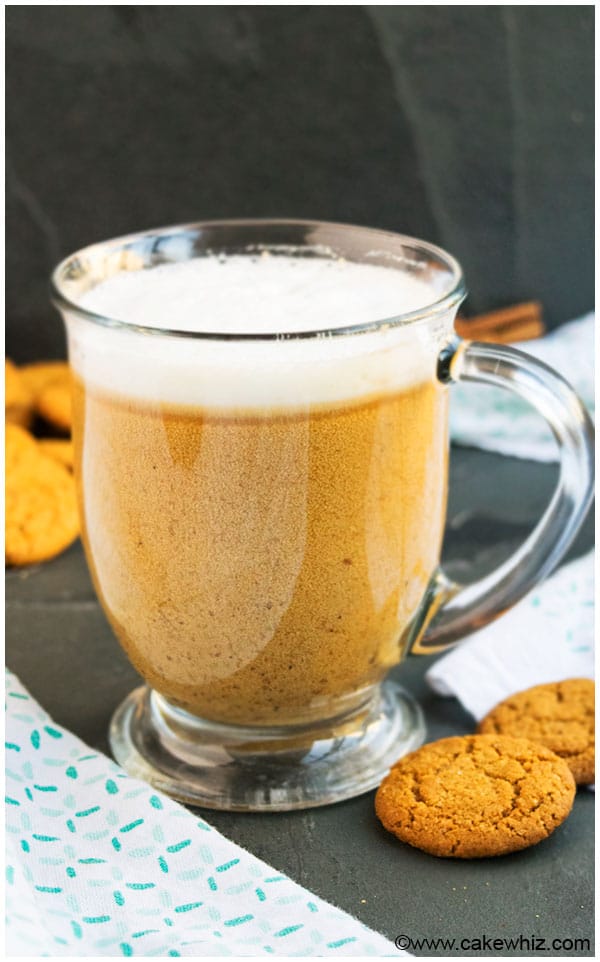 Easy Gingerbread Latte in Large Glass Mug on Black Stone Background. 