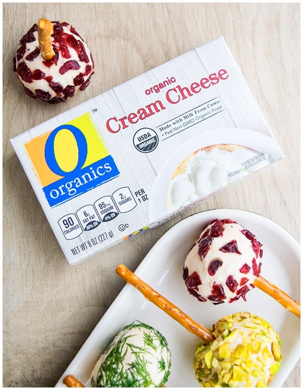 Box of O Organics Cream Cheese on Wood Background. 