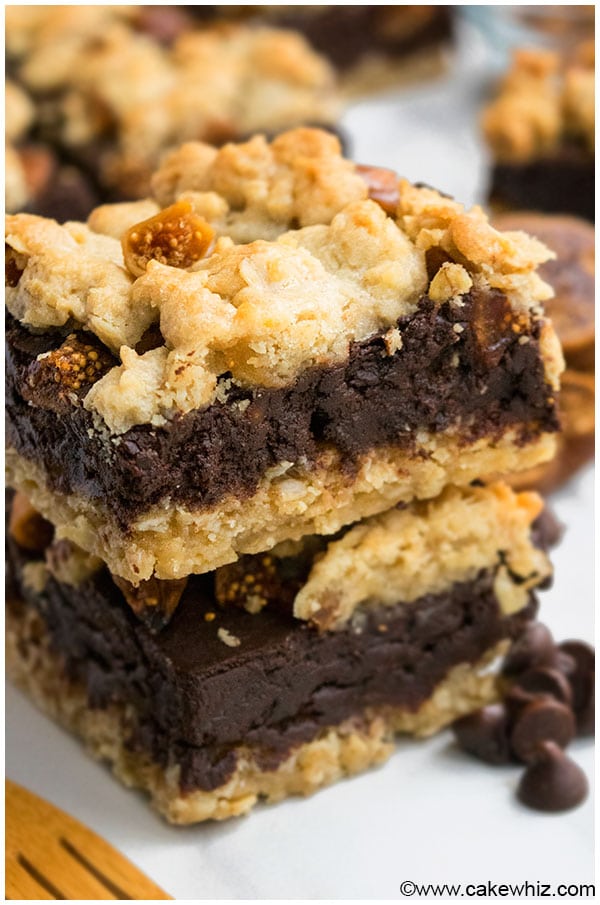 Stack of Best Fudgy Homemade Chocolate Oatmeal Bars on White Marble Background. 