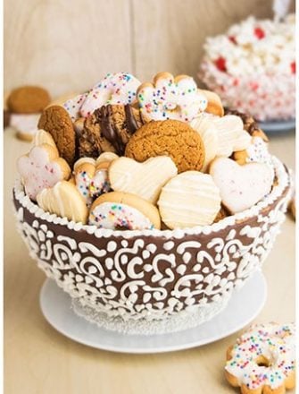 Easy Edible Cookie Bowls (Cookie Cups) Filled With Smaller Cookies on White Dish