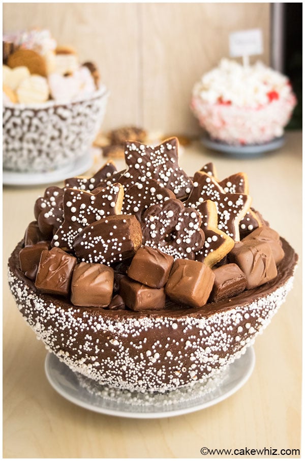 Homemade Deep Dish Chocolate Cookie Bowl Filled With Smaller Cookies on White Dish