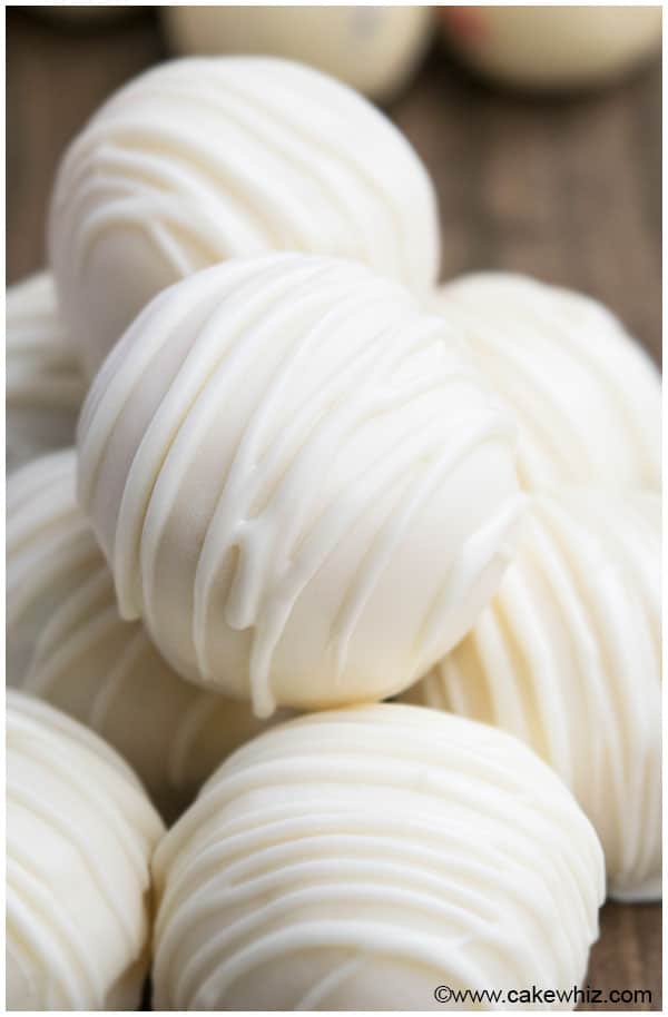 Stack of Easy White Chocolate Truffles on Wood Background. 